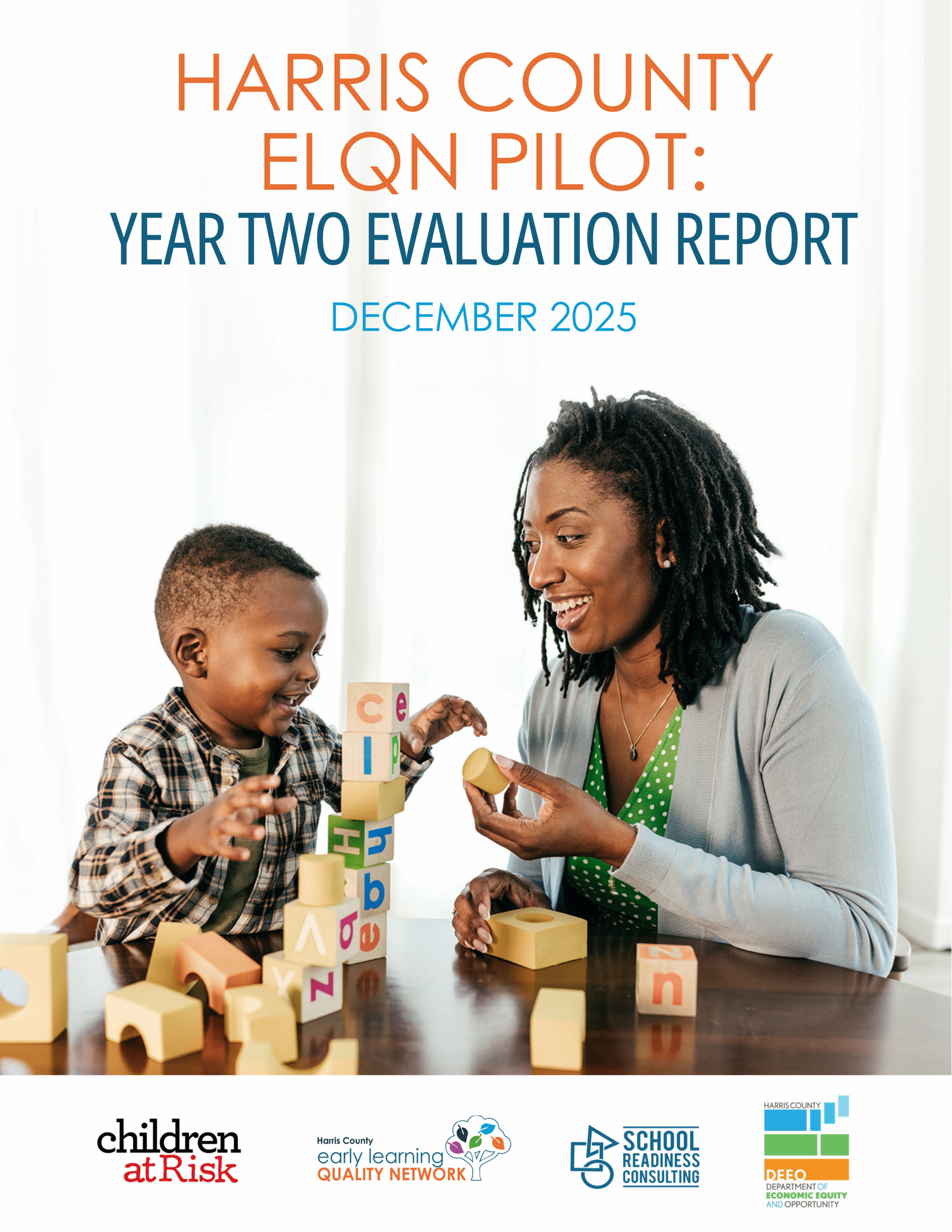 Engaged learning in Houston: young girl in Houston Cougars t-shirt uses magnifying glass to explore seashells, enhancing early childhood education in a diverse classroom setting.